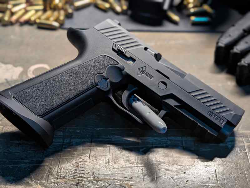 P320 with grip modules, mags and holsters.